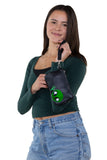 Friendly Alien Wristlet in Vinyl, wristlet style on model