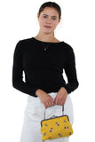 Bees Kisslock Bag in Yellow Cotton, handheld style on model