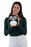 Wide-Eyed Penguin Shoulder Crossbody Bag in Vinyl Material, handheld by model