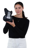 Guitar Crossbody Bag in Vinyl, black color, front view, handheld by model