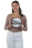 Officially Licensed Coca-Cola Round Disk Chenille Bag, white side, handheld by model