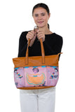 Three Pockets Unibrow Girl and Mariachi Skeleton Tote Bag in Vinyl Material, handheld by model