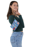 Route 66 Wristlet in Vinyl Material, blue color, handheld by model