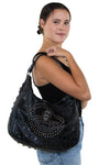 Studded Skull Hobo Bag in Vinyl Material, shoulder bag style on model
