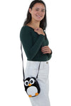 Wide-Eyed Penguin Shoulder Crossbody Bag in Vinyl Material, shoulder bag style on model