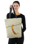 Peeking Tabby Tote Bag in Canvas Material, back view, handheld by model
