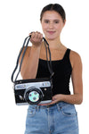 Camera Cross Body Bag in Vinyl, front view, handheld by model