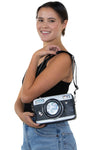 Camera Cross Body Bag in Vinyl, shoulder bag style on model