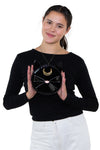 Mystical Black Cat Face Crossbody Bag in Vinyl, front view, handheld by model