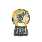 North American Wildlife Grasping Eagle Light-Up Slim Water Globe; with yellow light on 