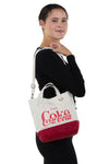 Coca-Cola Small Handheld Bag, shoulder bag style on model