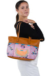 Three Pockets Unibrow Girl and Mariachi Skeleton Tote Bag in Vinyl Material, shoulder bag style on model